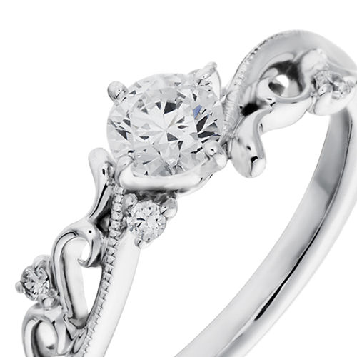 婚約指輪:唐草のような優美な模様のS字ラインにミル打ちを施しメレダイヤを添えたデザイン