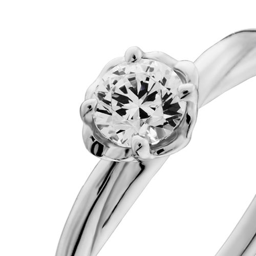 婚約指輪:一輪の花をモチーフにツイストしたアームが個性的なソリティアリング